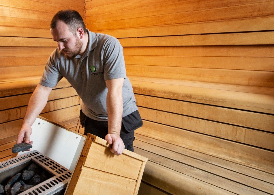 A person carrying out a gym risk assessment