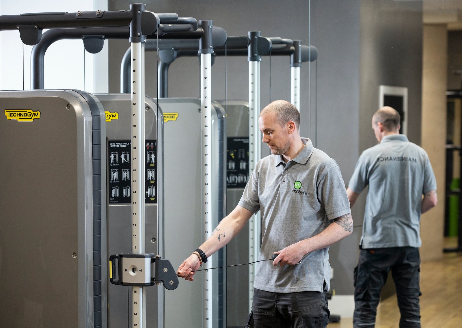 A person carrying out a gym risk assessment